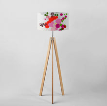 Load image into Gallery viewer, Red abstract floral drum lampshade on a wooden tripod floor lamp, showcasing vibrant colors and modern design.