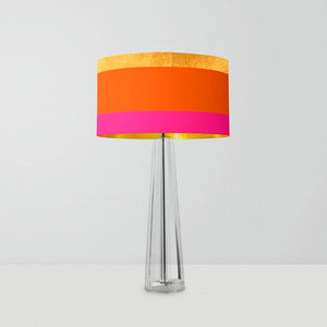 drum lampshade featuring three bold stripes in gold, bright orange, and pink