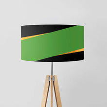 Load image into Gallery viewer, lampshade features a captivating geometric pattern of diagonal stripes in soothing green and luxurious gold on a sleek black background
