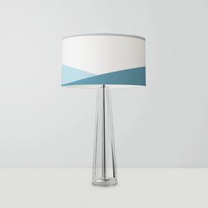 drum lampshade features an abstract geometric design inspired by the ocean