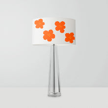 Load image into Gallery viewer, drum lampshade featuring a geometric abstract pattern of small orange flowers