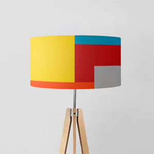 lampshade is a lively masterpiece featuring a colorful array of yellow, blue, red, orange, and grey squares