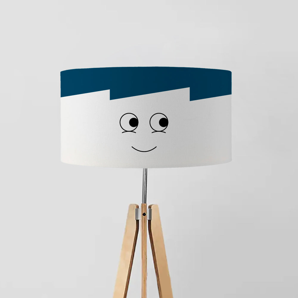 minimalist drum lampshade with a geometric design featuring the outline of a boy's face