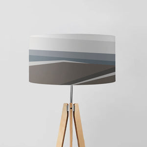 lampshade effortlessly marries the tranquility of a winter landscape with modern geometric patterns